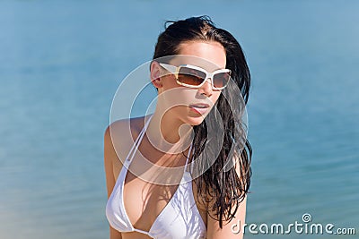 Young bikini model with white sunglasses Stock Photo