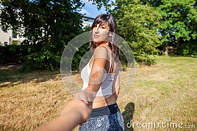 girl holds a mans hand Stock Photo
