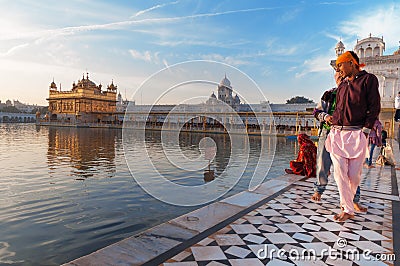 Young Sikh men visiting in Golden Temple in the early morning. Amritsar. India Editorial Stock Photo