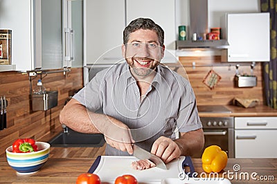 Young single handsome man cooking Stock Photo