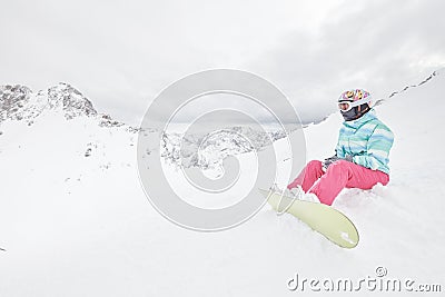 Young sitting woman with snowboard Stock Photo