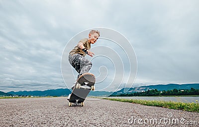 Young skateboarder make a tricks with skateboard Stock Photo