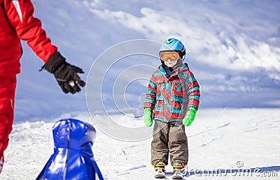 Young skier looking at ski instructor Stock Photo