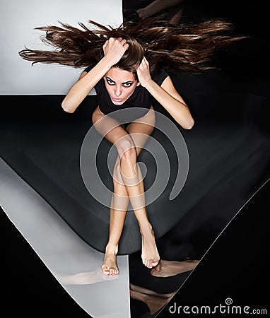 Young slim beautiful lady with long hairs running Stock Photo