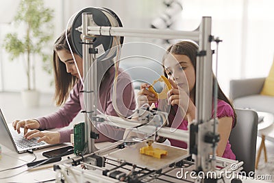 Young girls learning 3D printing at home Stock Photo