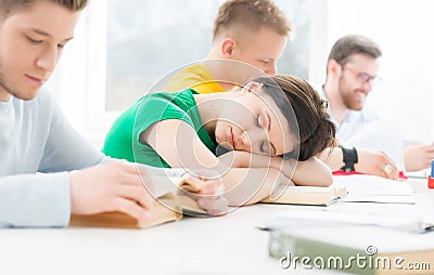 Young and smart students learning in a classroom Stock Photo