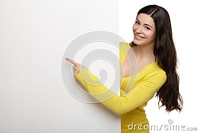 Young smile woman pointing at a blank board Stock Photo