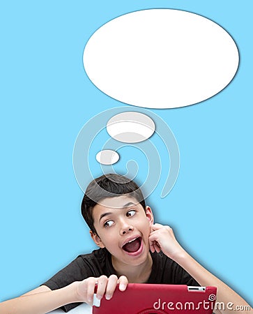 Young smiling boy with one hand resting on cheek with speech bubble against blue background Stock Photo