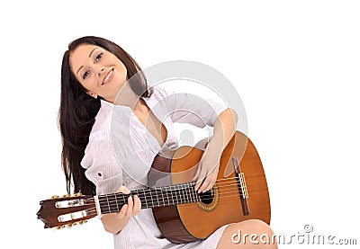 Young smiling brunette lady playing guitar Stock Photo