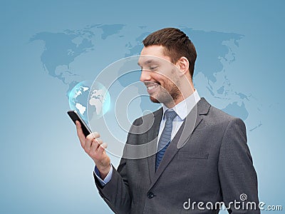 Young smiling businessman with smartphone Stock Photo