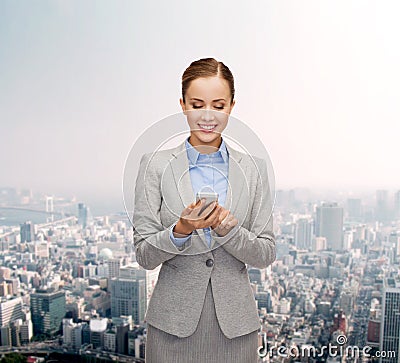 Young smiling businesswoman with smartphone Stock Photo