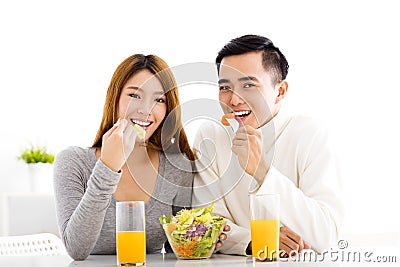 Young smiling couple eating healthy food Stock Photo