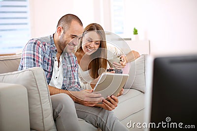 Young smiling couple having fun at home Stock Photo