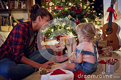 Young girls opening gifts.Cheerful Christmas gift at home Stock Photo
