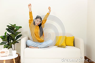 Young smiling women chill & relax raise arm after working and meeting at home. Stock Photo