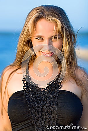 Young smiling woman with dishevelled hairs Stock Photo