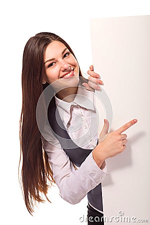 Young smiling woman pointing on blank board Stock Photo