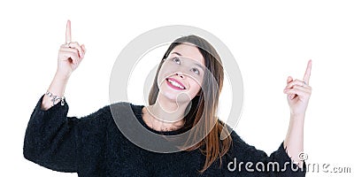 Young smiling woman pointing up looking up Stock Photo