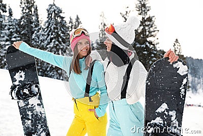 Young snowboarders wearing winter sport clothes Stock Photo