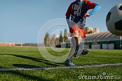 Young soccer goalie starting game kicking ball from white goal line Stock Photo