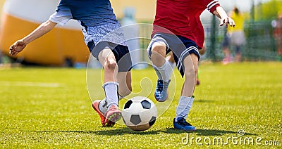 Young Soccer Players Competition. Boys Kicking Football Ball Editorial Stock Photo