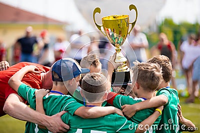 Young Soccer Players Holding Trophy. Boys Celebrating Soccer Football Championship Editorial Stock Photo