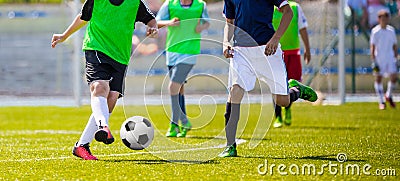 Young Soccer Players Running After the Ball on the Pitch Editorial Stock Photo