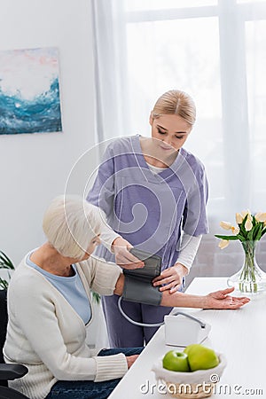 young social worker putting cuff of Stock Photo