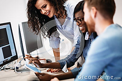 Software engineers working on project and programming in company Stock Photo