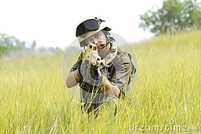 Young soldier in helmet targeting Stock Photo