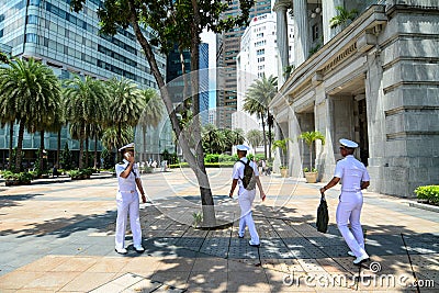 Young soldiers walking on street in Singapore Editorial Stock Photo