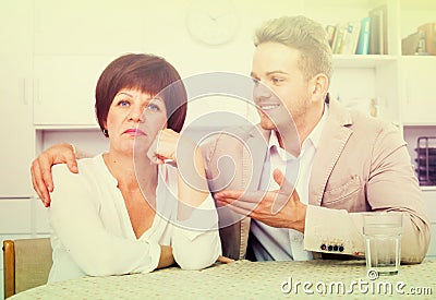 Young son calms mother Stock Photo