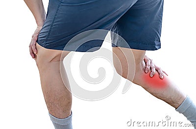 Young sport man with strong athletic legs holding knee Stock Photo