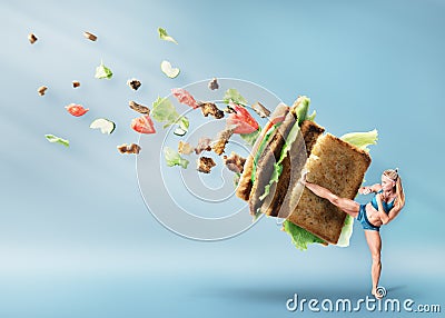 Young sport women boxing a hamburger Stock Photo