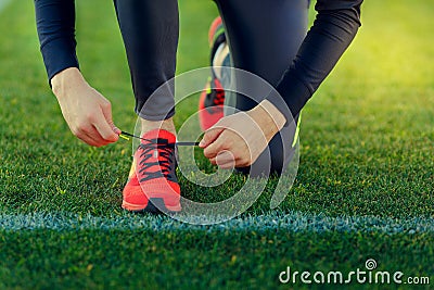 Young sportsman dresses his shoes Stock Photo