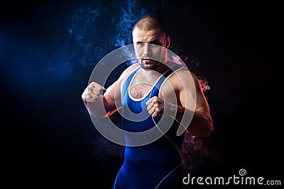 Wresler posing on black Stock Photo