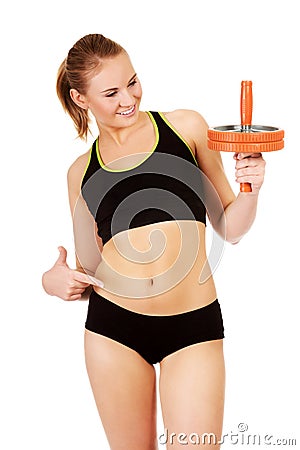 Young and sporty woman holding sport wheel Stock Photo