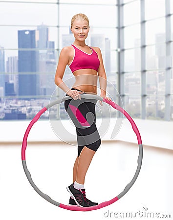 Young sporty woman with hula hoop Stock Photo