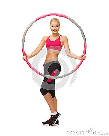 Young sporty woman with hula hoop Stock Photo