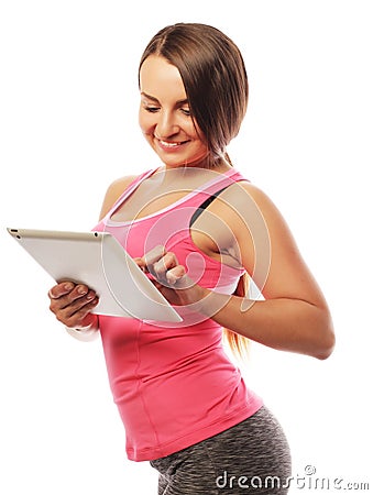 Young sporty woman using a digital tablet Stock Photo