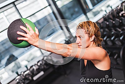 Young sporty woman working out with a ball Stock Photo