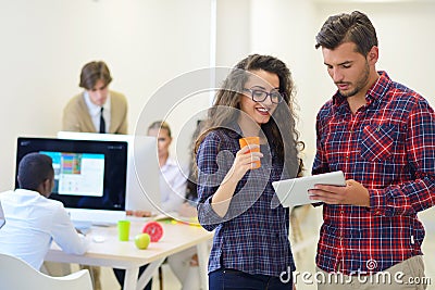 Young startup business people, couple working on tablet computer Stock Photo