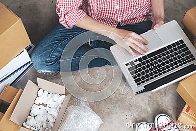 Young startup entrepreneur small business owner working at home, packaging and delivery situation. Stock Photo