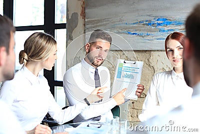 Young startups businessmen teamwork brainstorming meeting to discuss the investment Stock Photo