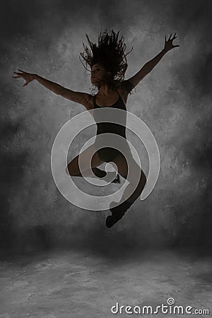 Young Street Dancer Leaping Mid Air Stock Photo