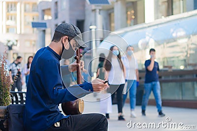 Young street musician performer on Yerevan North avenue after covid 19 lockdown Editorial Stock Photo