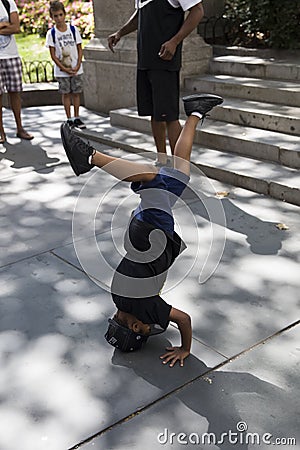 Young street performer or busker on the street of New York City Editorial Stock Photo