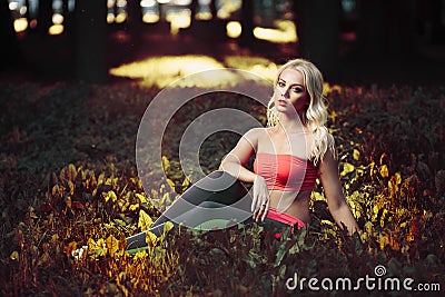 Young strong girl do exercises during street workout Stock Photo