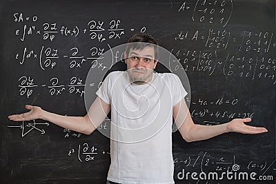 Young student is doing math exam and dont know how to solve difficult mathematical problem Stock Photo