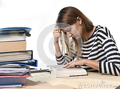 Young student girl concentrated studying for exam at college library education concept Stock Photo